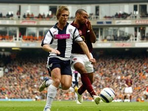 Albion's Martin Albrechtsen does battle with Arsenal legend Thierry Henry during his days in the Baggies backline