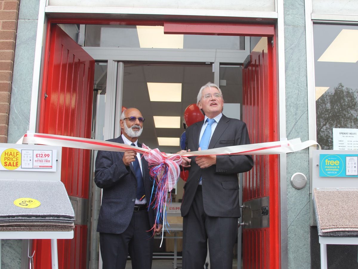 Andrew Mitchell MP and Aziz Arif cut the ribbon on the new United Carpets store in Mere Green.
