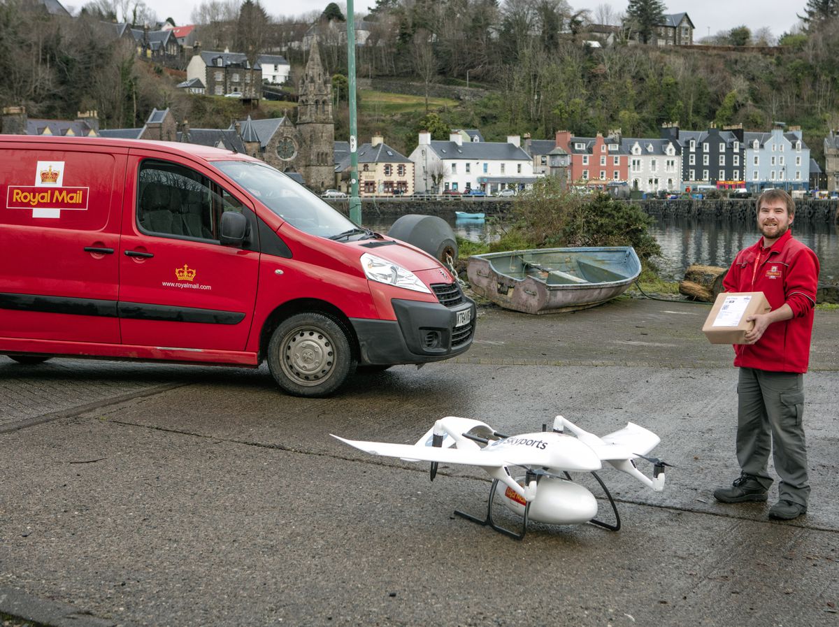 Postman Tom Nunn on the Isle of Mull with a Royal Mail Skyports drone. Picture: Chris Gorman/Royal Mail