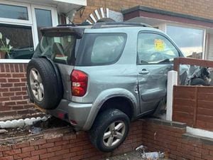 A car crashed into a house on Lister Road, Beechdale, Walsall on June 9. Photo: Trevor Bailey