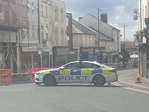 The police cordon at the top of Lower High Street, next to Market Place, in Wednesbury. Photo: David Wilkes