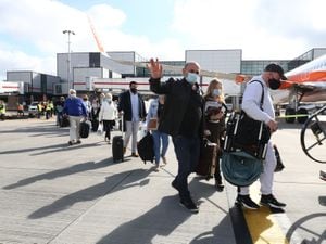 Passengers prepare to board an easyJet flight to Faro, Portugal.
