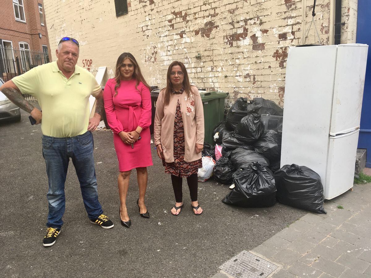 Jiwan Lata Gaind (right) with Councillors Carl Creaney and Simran Cheema with the rubbish in Market Place, Willenhall. Photo: Gurdip Thandi.