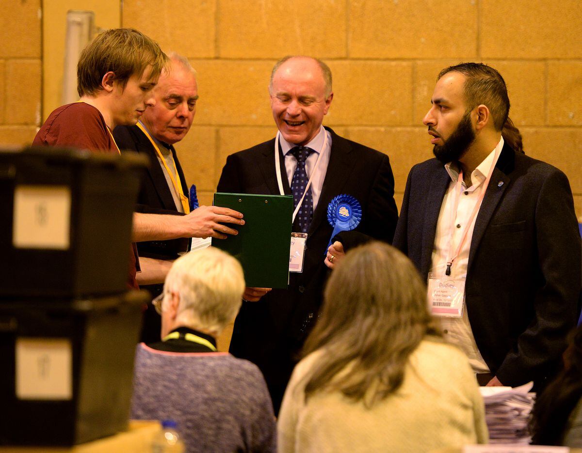 Marco Longhi, centre, the Conservative candidate for North
