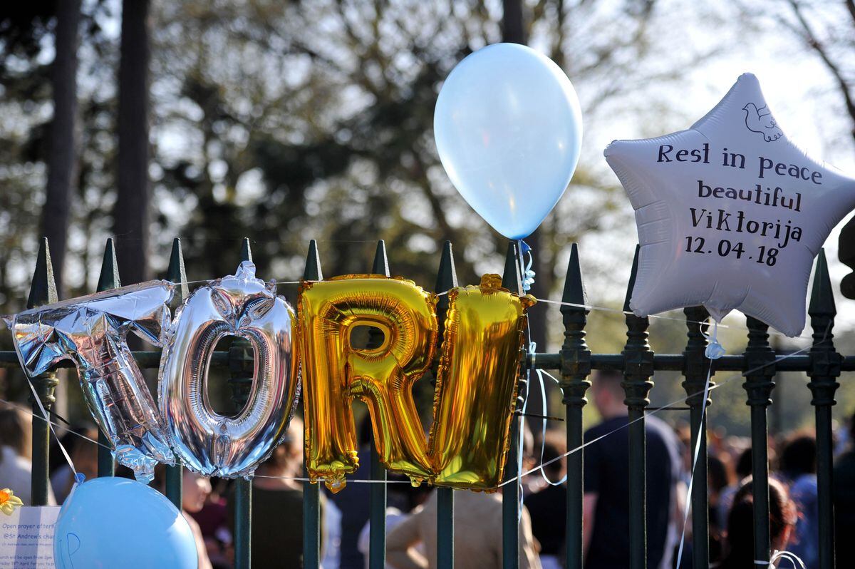 Balloons were tied to the park fence during a gathering in VIktorija's memory