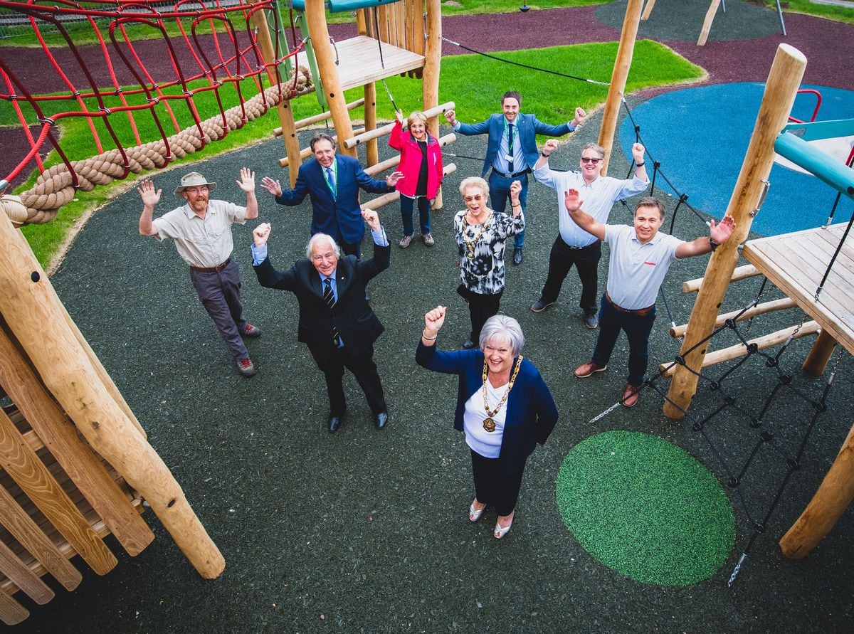Celebrations as the new play area officially opens. Back row, left to right: Steve Gallis from Baggeridge Country Park, Councillor Roger Lees, Councillor Marcia Sinclair from Himley Parish Council , Mark Jenkinson and Simon Nuttall from South Staffordshire Council and Paul Greenfield from Kompan.Front row, left to right: Councillor Len Bates BEM, Cabinet Member for Community Services, Councillor Yvonne Nock, Chair of Himley Parish Council, and Kath Williams, Chairman of South Staffordshire Council.