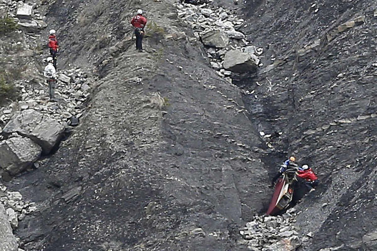 Rescue teams work on debris at the plane crash site near Seyne-les-Alpes, France