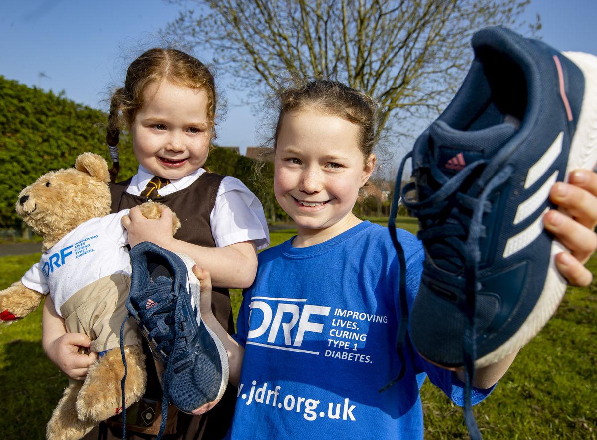 Millie Baynham-Hughes poses with her sister Lola, who has type 1 diabetes.
