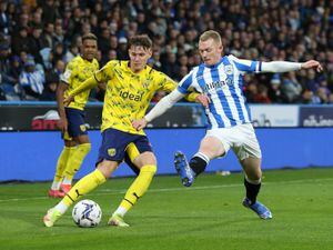West Bromwich Albion's Taylor Gardner-Hickman (left) crosses a ball past Huddersfield Town's Lewis O'Brien