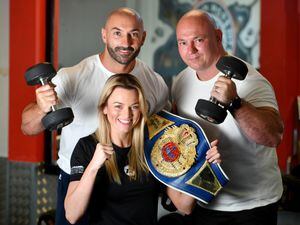 WOLVERHAMPTON COPYRIGHT MNA MEDIA TIM THURSFIELD 14/07/22.Katie Healy from Bilston, who has become the WBF Women's Super Bantamweight World Champion. She trains at Iron Masters Gym, Bilston. She is pictured with brothers Carlo and Santino Sellick from Iron Masters Gym..