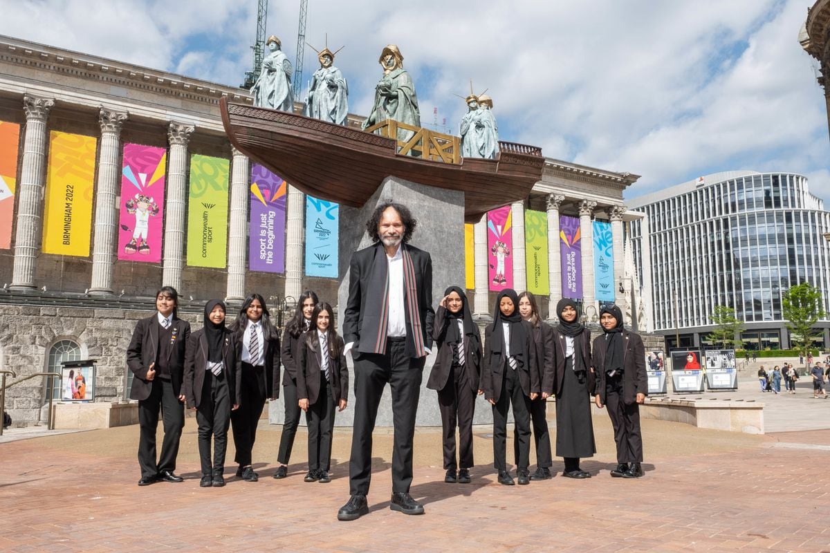 Hew Locke and students from the Small Heath Leadership Academy at the launch of his reimagined sculpture of Queen Victoria in Birmingham's city-centre 