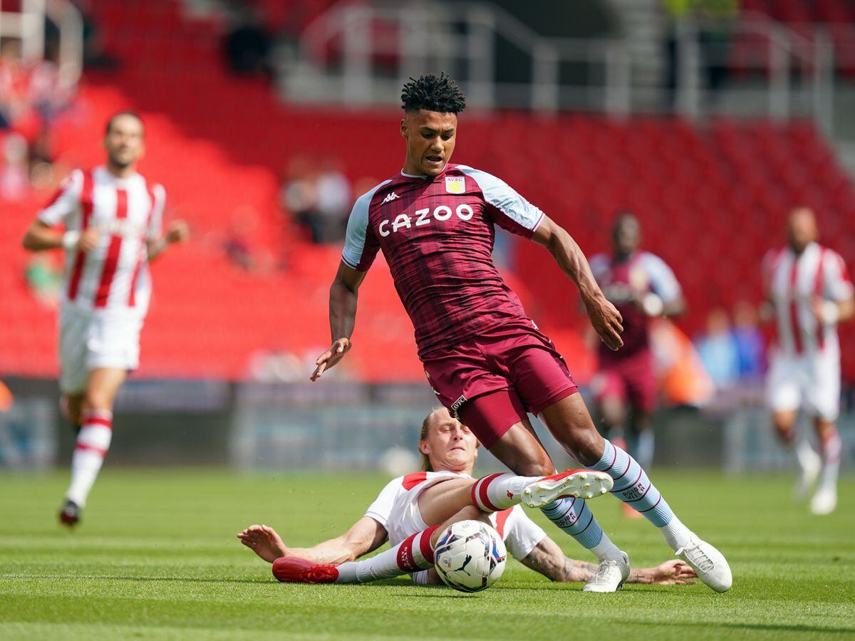 Aston Villa's Ollie Watkins battles with Stoke City's Ben Wilmot during the pre-season friendly match at the bet365 Stadium, Stoke-on-Trent. Picture date: Saturday July 24, 2021. PA Photo. See PA story SOCCER Stoke. Photo credit should read: Nick Potts/PA Wire. ..RESTRICTIONS: EDITORIAL USE ONLY No use with unauthorised audio, video, data, fixture lists, club/league logos or "live" services. Online in-match use limited to 120 images, no video emulation. No use in betting, games or single club/league/player publications..