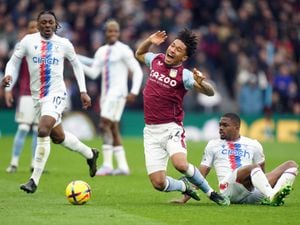 Aston Villa's Boubacar Kamara is tackled by Crystal Palace's Cheick Doucoure 