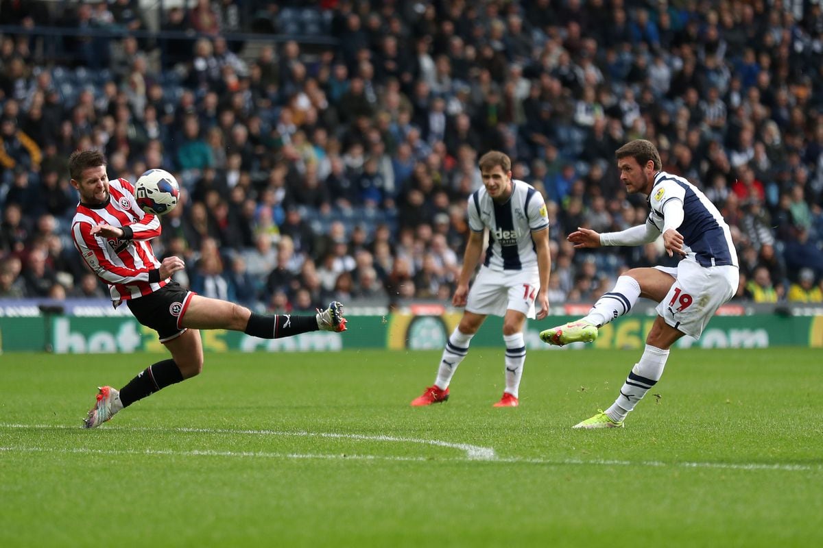 WEST BROMWICH, ENGLAND - OCTOBER 29: Oliver Norwood of Sheffield United blokcs the shot at goal from John Swift of West Bromwich Albion during the Sky Bet Championship between West Bromwich Albion and Sheffield United at The Hawthorns on October 29, 2022 in West Bromwich, United Kingdom. (Photo by Adam Fradgley/West Bromwich Albion FC via Getty Images).