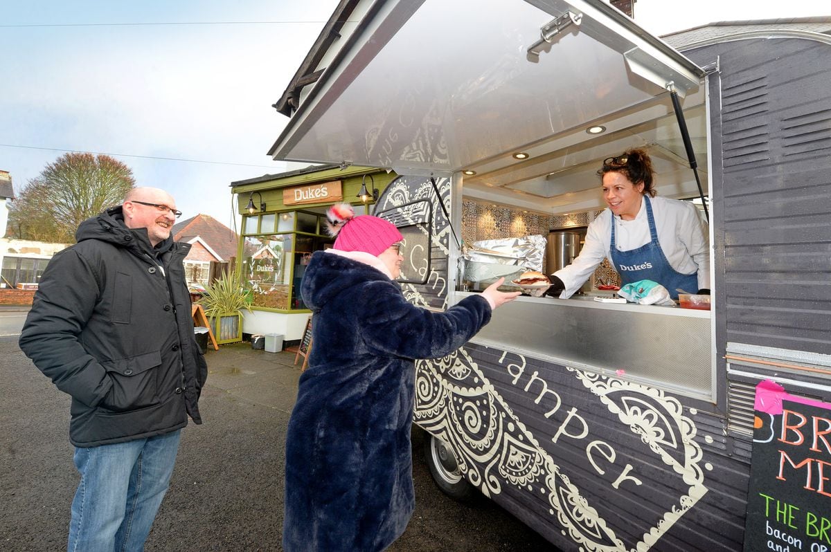 Charlie Taylor, owner of Duke’s Cafe, selling breakfasts from a van outside the shop