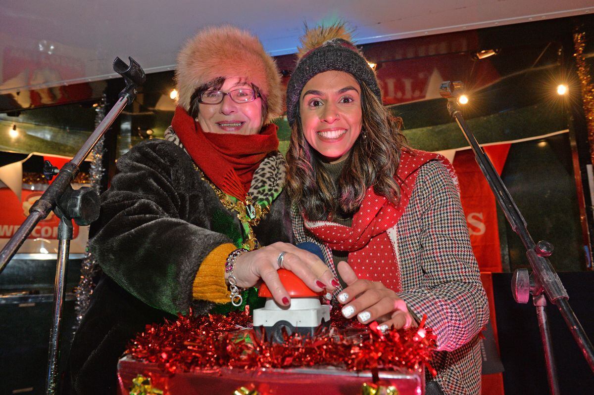 Mayor Anne Millward and Amber Sandhu switch on the lights in Dudley