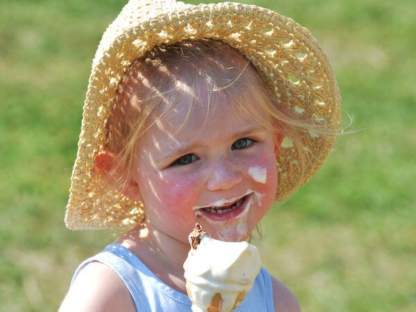 Amelia Cox, aged three, of Heath Hayes, keeps cool with an ice-cream