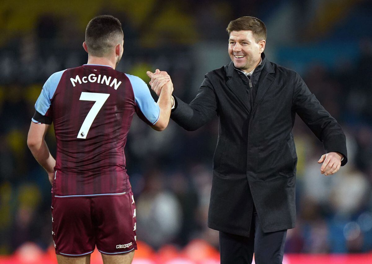               Aston Villa's John McGinn (left) greets manager Steven Gerrard