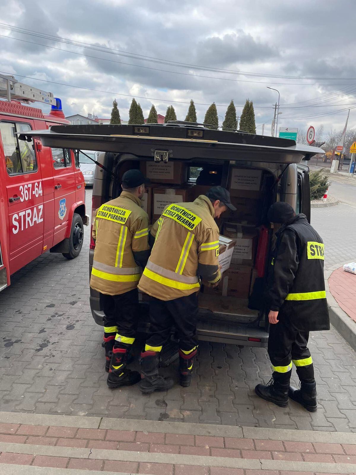 The firefighters help unload the aid. Picture: Facebook
