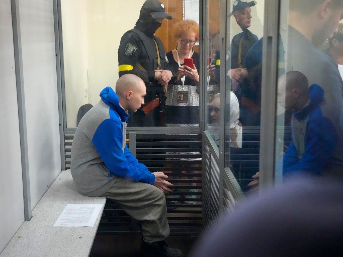 Russian Sgt Vadim Shishimarin, 21, is seen behind glass during a court hearing in Kyiv, Ukraine, on Friday May 13 2022
