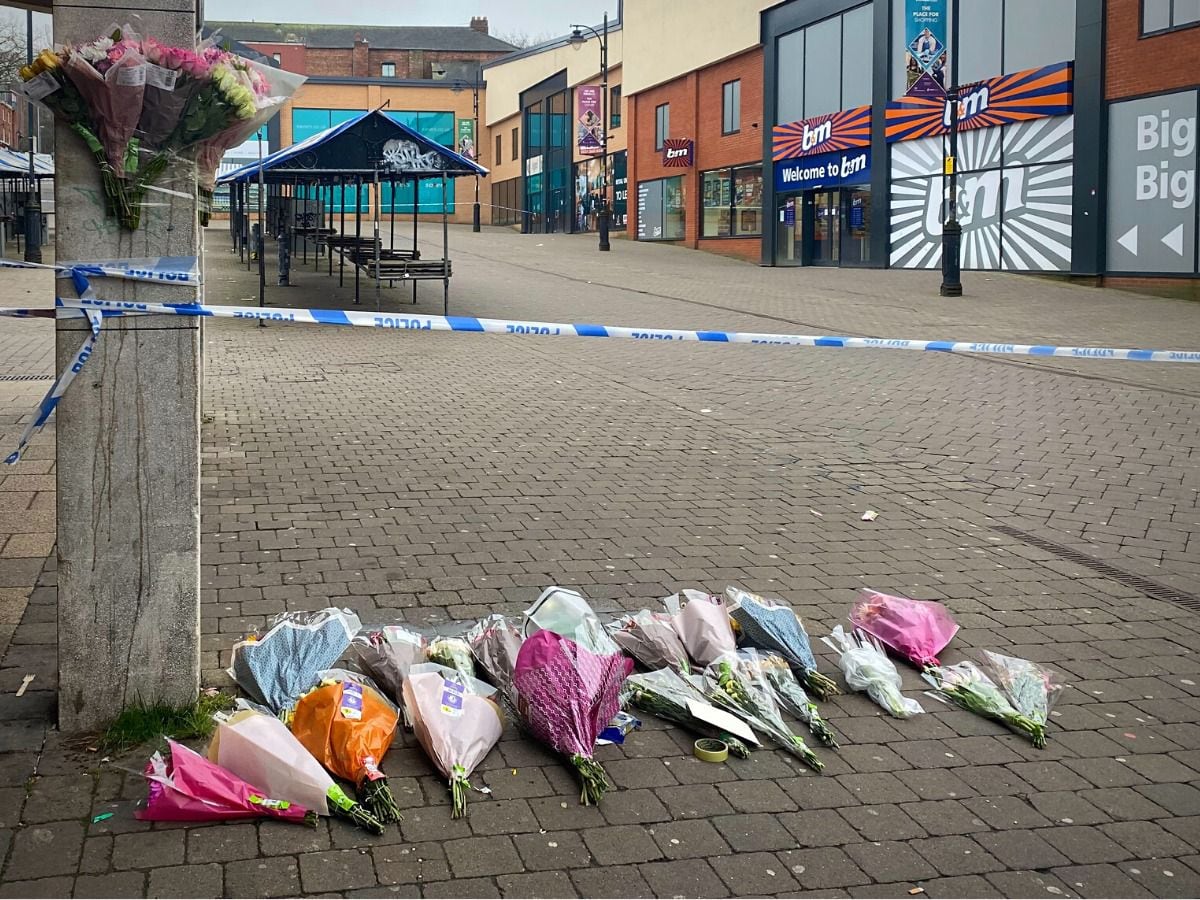 Tributes left at the scene where police cordoned off the street. 