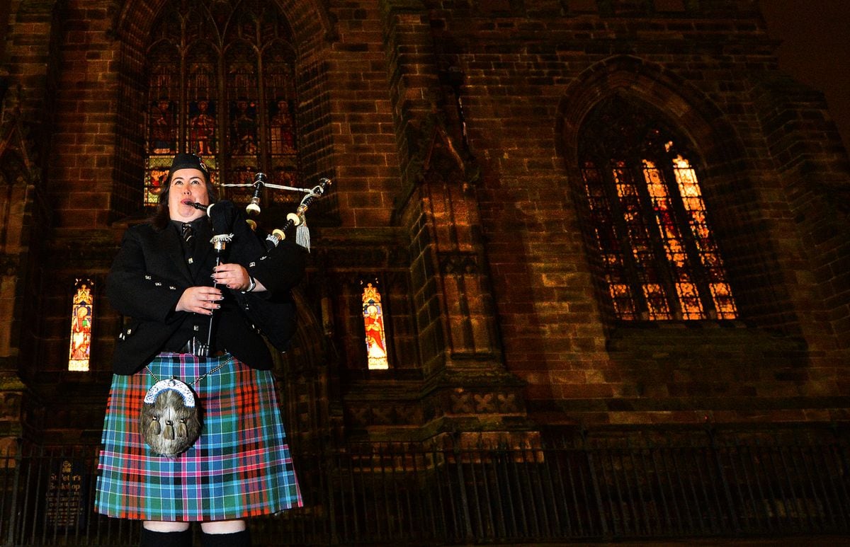 A lone piper, Vicki Kennerley from the Wolverhampton Pipe band played a lament on the steps of St Peter's Church, in Wolverhampton