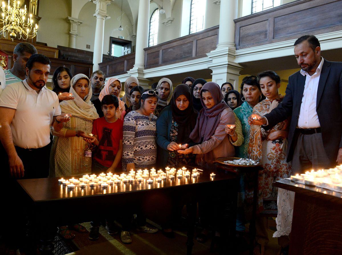 Interfaith candel light vigil held at St John's Church in Wolverhampton in memory of the Manchester attack.  Members of mosques from Wolverhampton at the vigil.