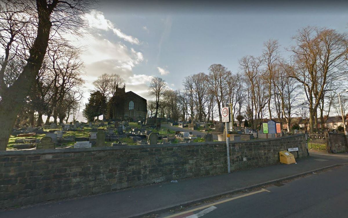 Council workers maintain the graveyard at St Andrew's Church in Netherton
