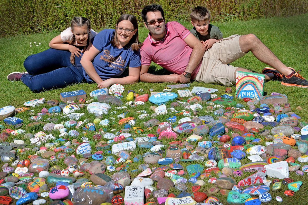 Michelle and Rod Woodward's and children Olivia, and Joshua have painted stones to place in a park behind Sutherland Road