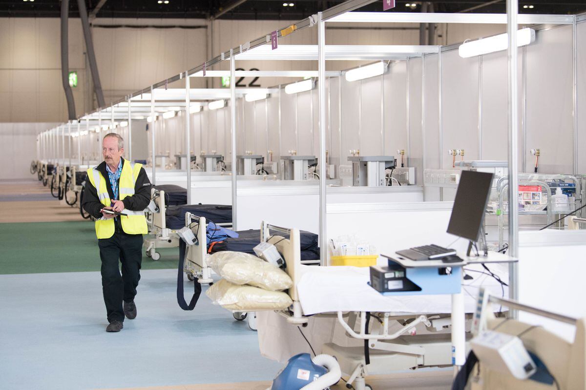 Temporary beds set up in the ExCel centre, which alongside Birmingham's NEC, is becoming the temporary NHS Nightingale hospital