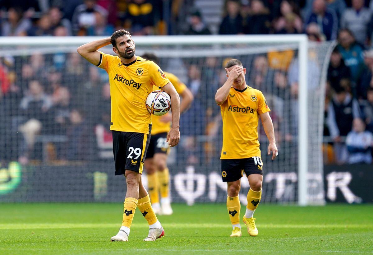 
              
Wolverhampton Wanderers' Diego Costa (left) and Daniel Podence appear dejected after Leicester City's Harvey Barnes (not pictured) scores his side's second goal of the game during the Premier League match at the Molineux, Wolverhampton. Picture date: Sunday October 23, 2022. PA Photo. See PA story SOCCER Wolves. Photo credit should read: Nick Potts/PA Wire.


RESTRICTIONS: EDITORIAL USE ONLY No use with unauthorised audio, 
video, data, fixture lists, club/league logos or "live" services. Online in-match use limited to 120 images, no video emulation. No use in betting, games or single club/league/player publications.
            
