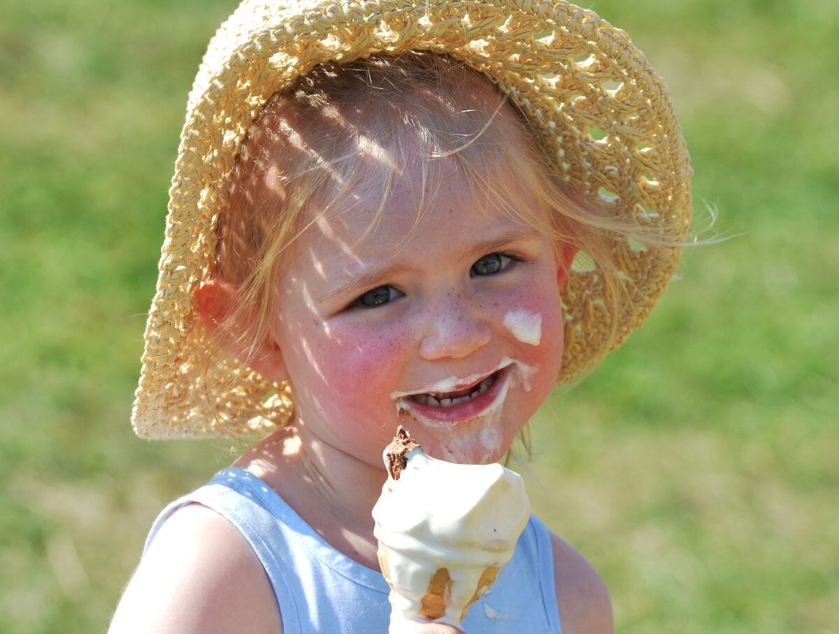 Amelie Cox, aged three, of Heath Hayes, keeps cool with an ice-cream
