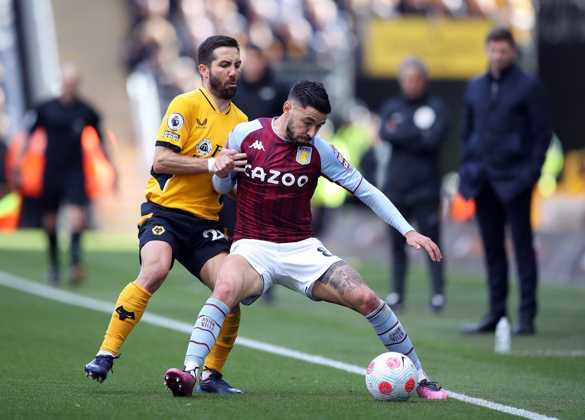 Wolverhampton Wanderers' Joao Moutinho and Aston Villa's Morgan Sanson (right) battle for the ball during the Premier League match at the Molineux Stadium, Wolverhampton. Picture date: Saturday April 2, 2022. PA Photo. See PA story SOCCER Wolves. Photo credit should read: Isaac Parkin/PA Wire.