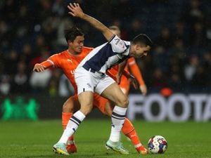 Kenny Dougall of Blackpool and Tom Rogic of West Bromwich Albion during the Sky Bet Championship between West Bromwich Albion and Blackpool at The Hawthorns on November 1, 2022 in West Bromwich, United Kingdom. (Photo by Adam Fradgley/West Bromwich Albion FC via Getty Images).