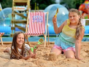 Luella Humphreys and Lola Moran enjoy the sand at West Park