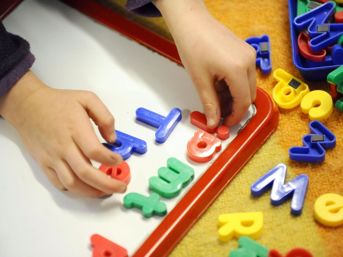 A child playing with letters