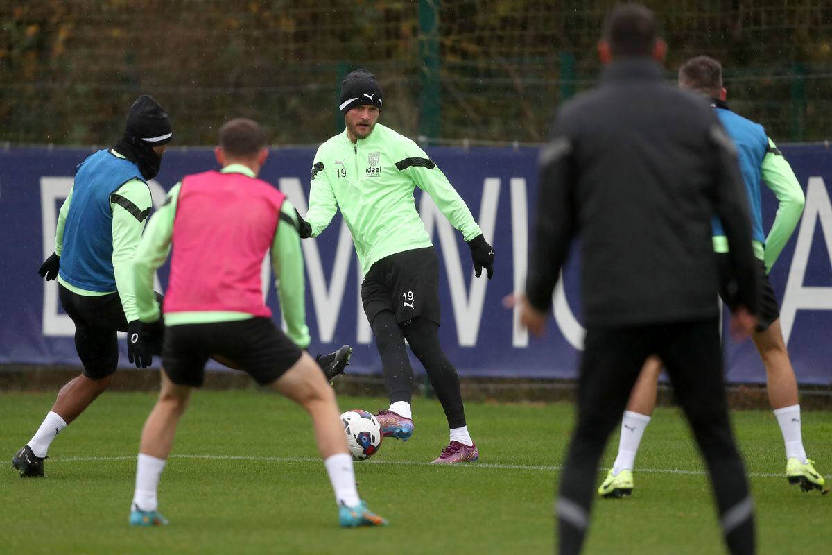 A surrounded John Swift during Albion's first training session since returning (Photo by Adam Fradgley/West Bromwich Albion FC via Getty Images).