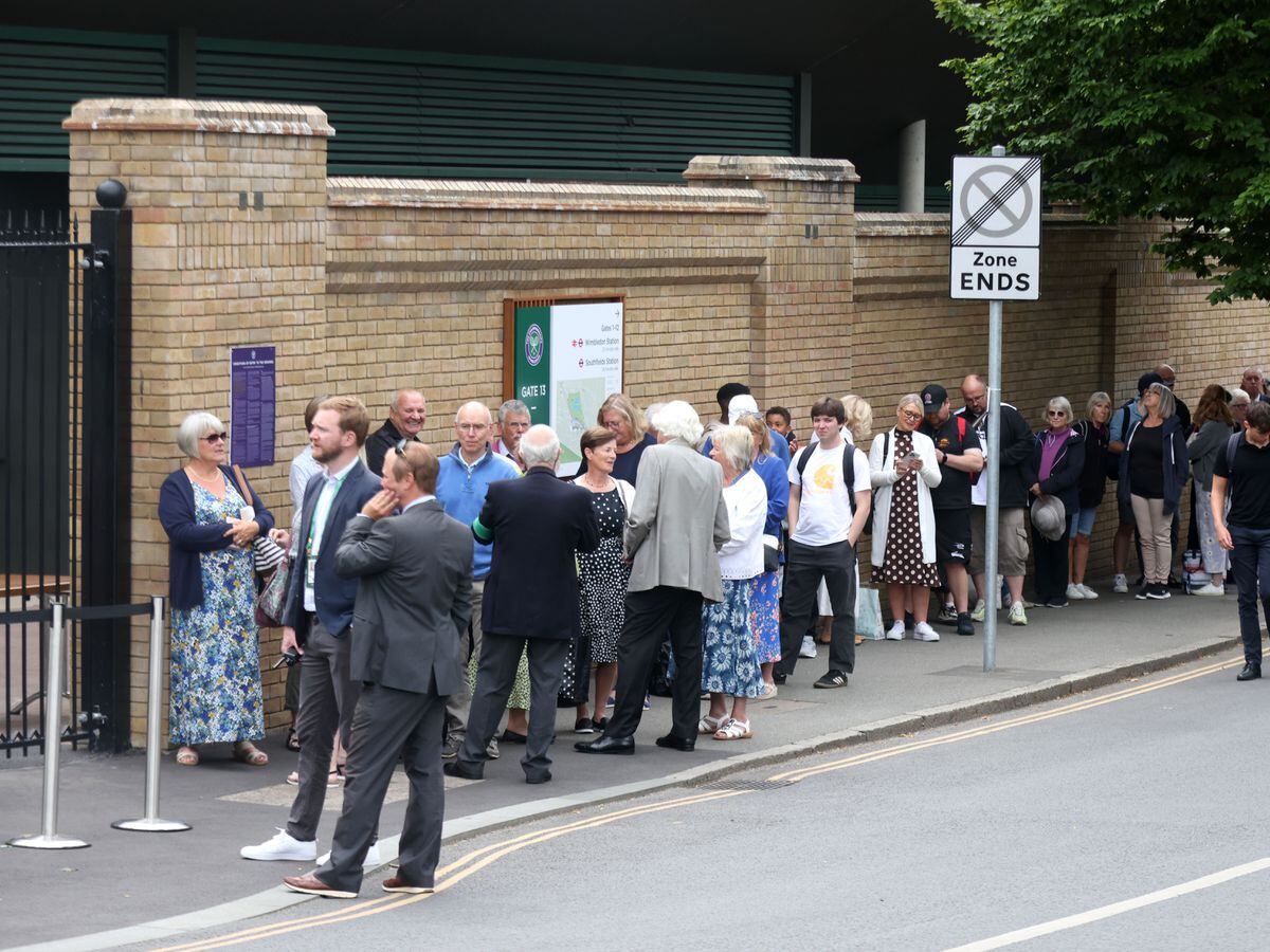 People wait in a queue to get entry to the Wimbledon Championships on June 29 2022 (James Manning/PA)