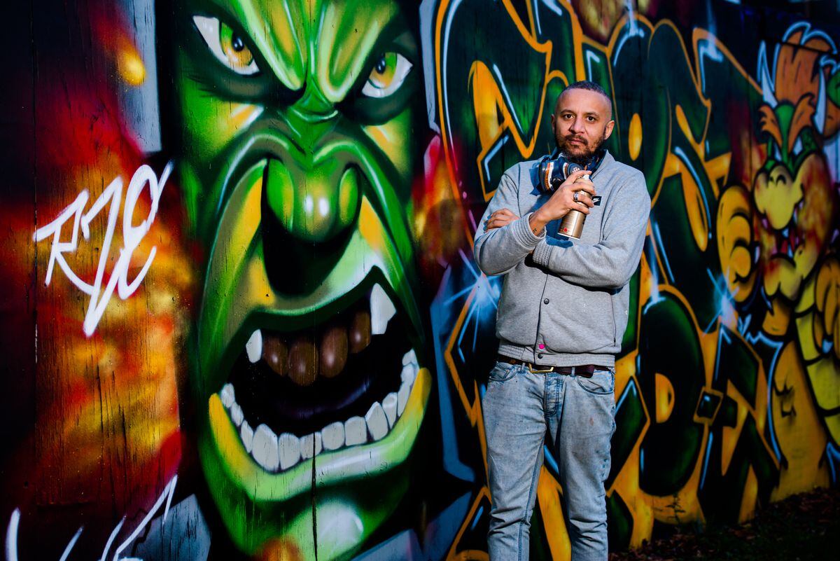 Graffiti Artist Lee Smith with his latest work