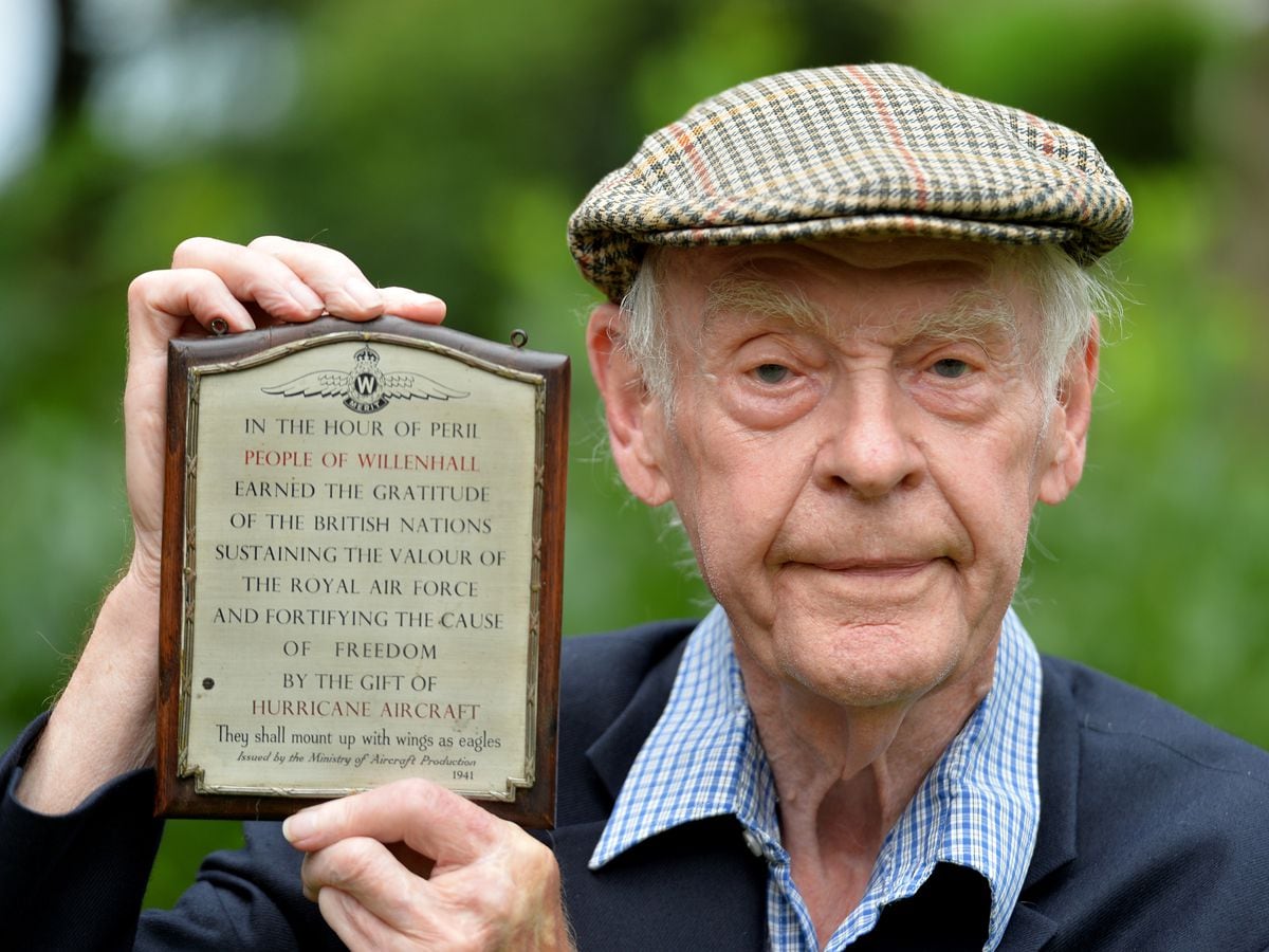 Trevor Matthews with the plaque recognising the efforts of people from Willenhall in assisting the war effort