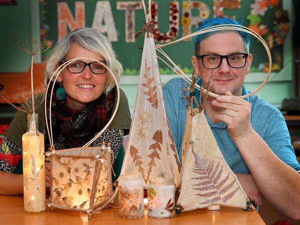 Artist Sophie Handy helped people create a willow lantern using pressed flowers. Also pictured is organiser Paul Ryder