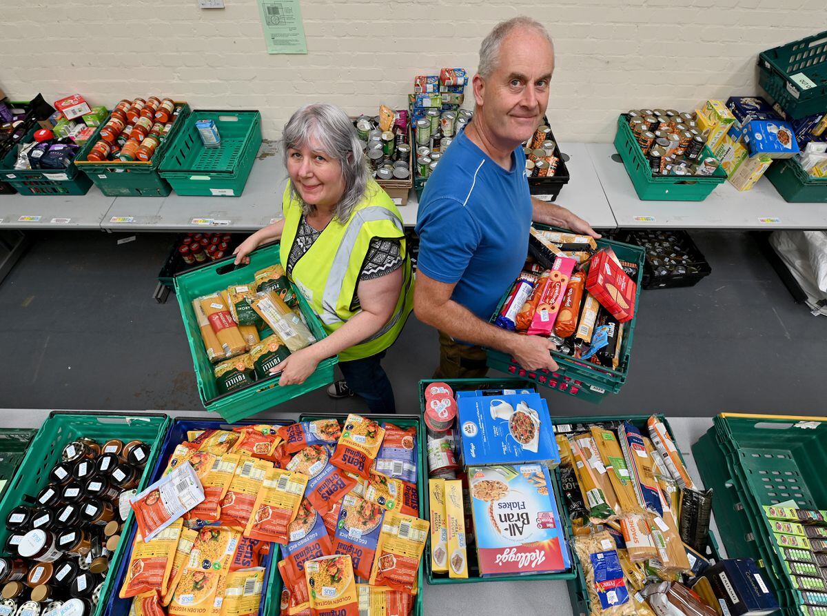 Christine Endean and Gary Price from The Well keep the food parcels stocked
