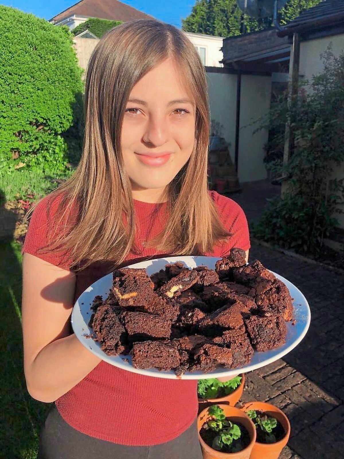 Jessica Drew with a plate of her brownies, made with white, milk and dark chocolate