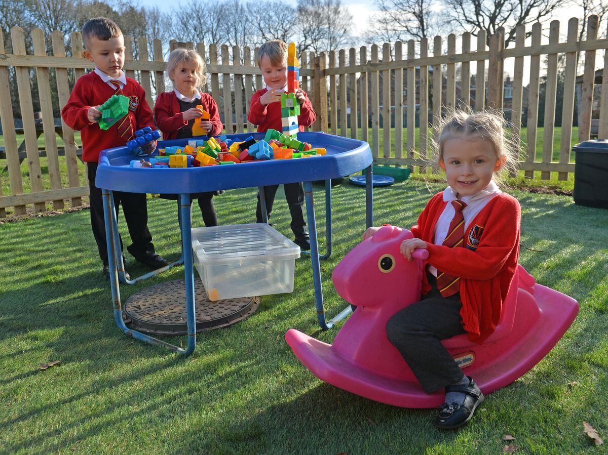 St Michael's School, Pelsall, showing what they spent the money on from the Express & Star Cash For Schools competition. Pictured front is Miley-Nel Davies with her friends in the outdoor Afternoon nursery
