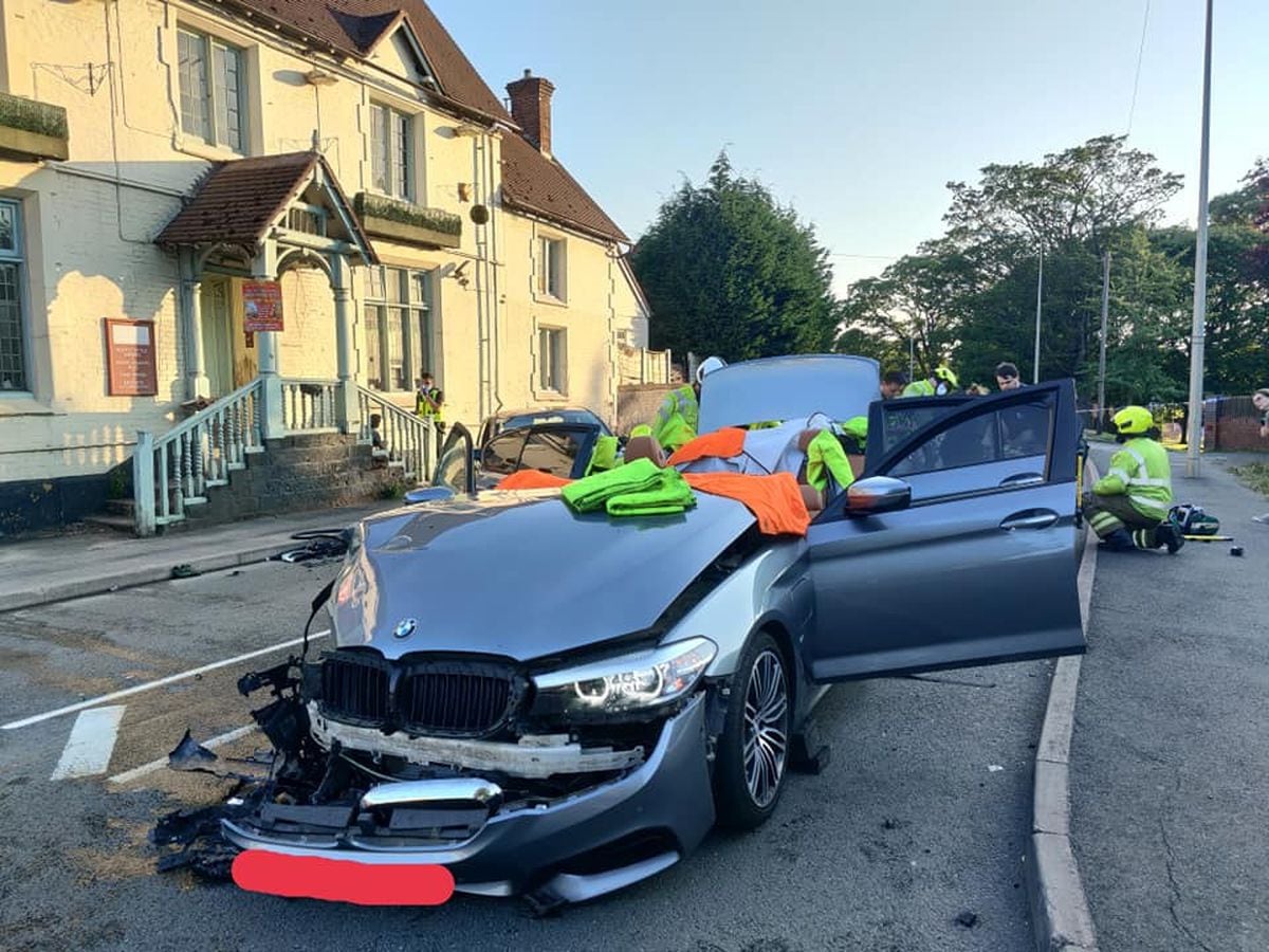 The BMW with its roof removed following the crash in Kingswinford. Photo: WMFS
