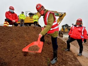 Helping to break the ground at the new base are Midlands Air Ambulance chairman Roger Pemberton, front, with air operations manager Ian Jones and chief executive Hanna Sebright. Behind are Mike Jones and Glyn O'Hara of Morris Property
