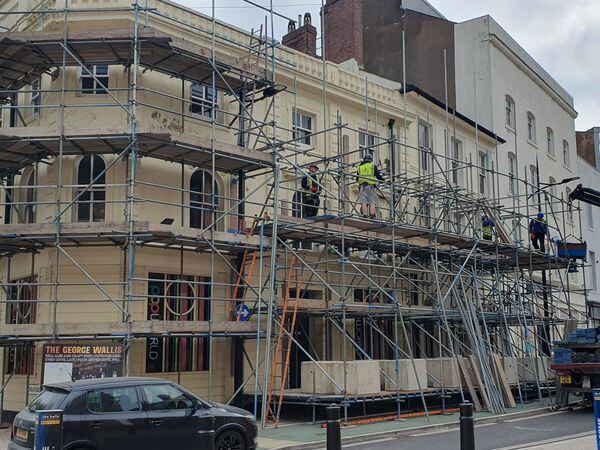 Scaffolding has been set up along the exterior of the building on North Street