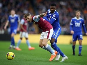               Aston Villa's Lucas Digne and Leicester City's Kelechi Iheanacho (right) battle for the ball