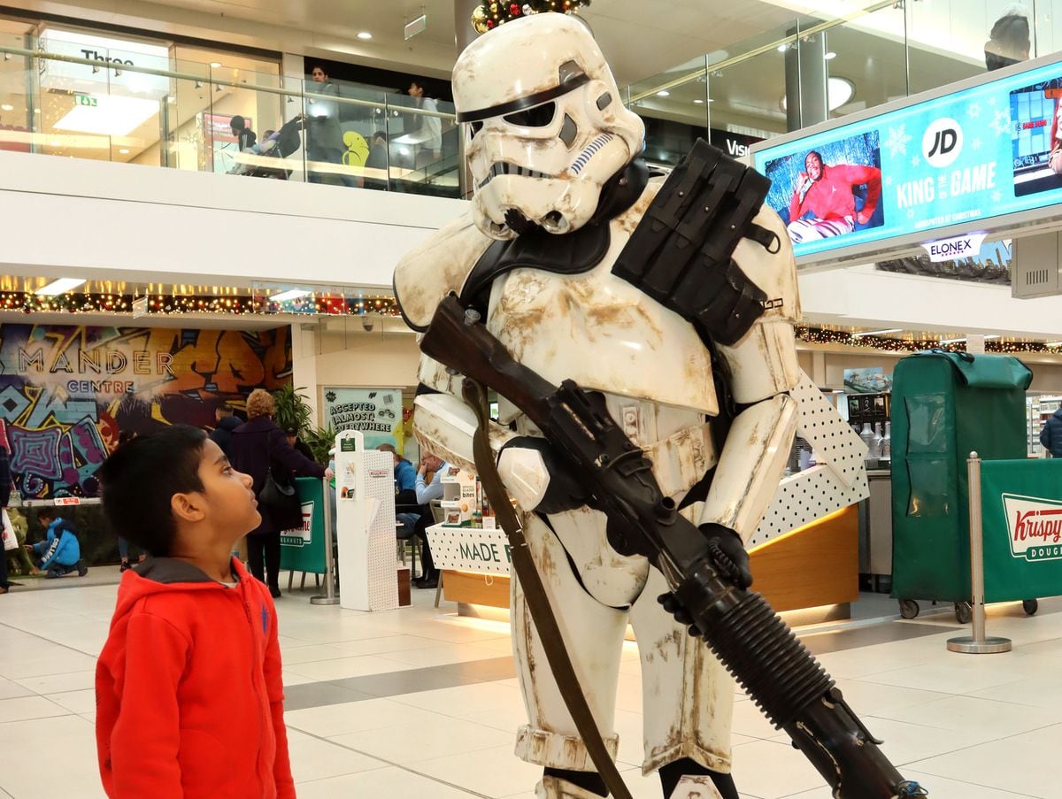 Four-year-old Ashish Gharu meets a Star Wars stormtrooper at GeekCon
