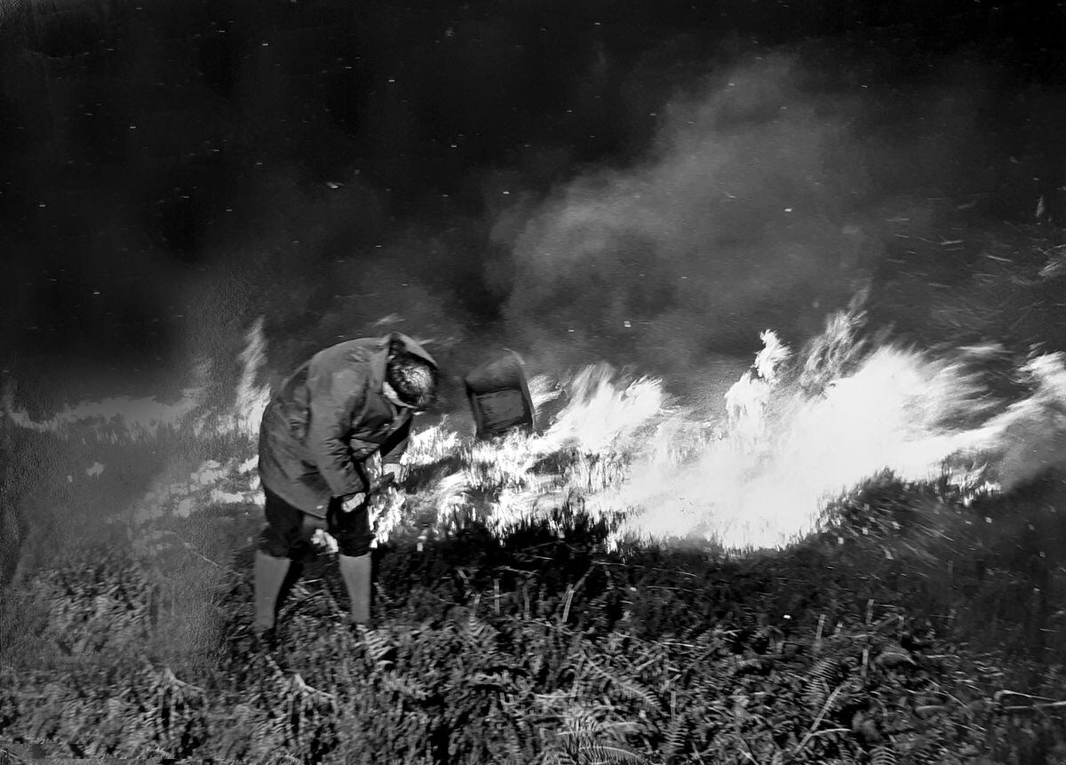 Chase warden Gerald Springthorpe going into action to help out firemen during a heathland fire in April, 1972